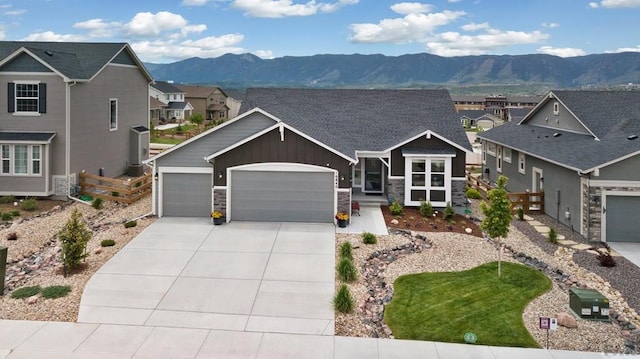 16840 New Autum Dr, Monument, CO 80132 - craftsman-style home featuring a mountain view, an attached garage, board and batten siding, concrete driveway, and stone siding