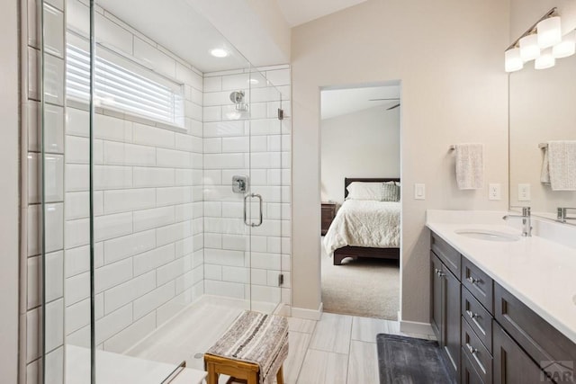 16840 New Autum Dr, Monument, CO 80132 - ensuite bathroom featuring a shower stall, double vanity, and baseboards