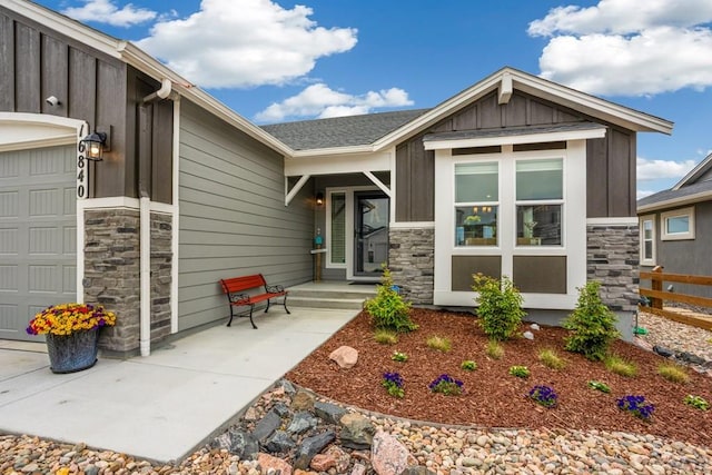 16840 New Autum Dr, Monument, CO 80132 - view of front of property featuring an attached garage, stone siding, and board and batten siding
