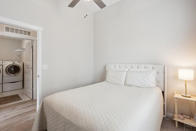 16840 New Autum Dr, Monument, CO 80132 - carpeted bedroom featuring independent washer and dryer, lofted ceiling, and a ceiling fan
