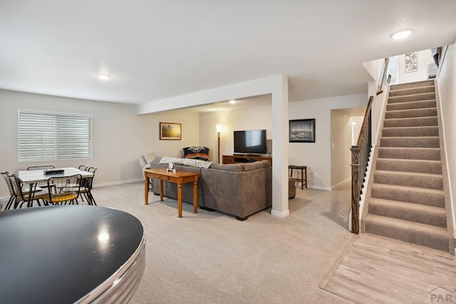 16840 New Autum Dr, Monument, CO 80132 - living room featuring stairs, light carpet, and baseboards