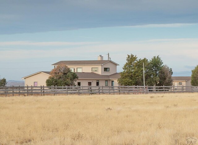 view of front of property featuring fence