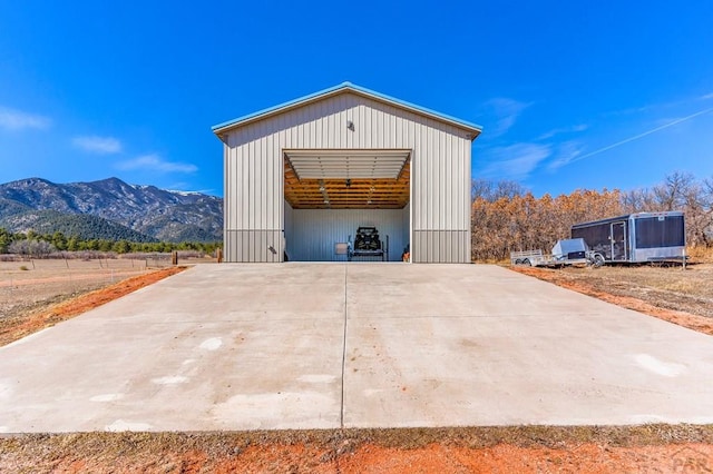 view of outbuilding featuring a mountain view