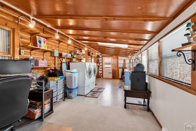 interior space featuring baseboards and washing machine and clothes dryer