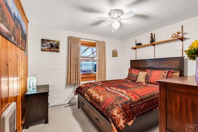 bedroom with light carpet and ceiling fan