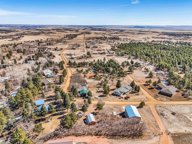 birds eye view of property with view of desert