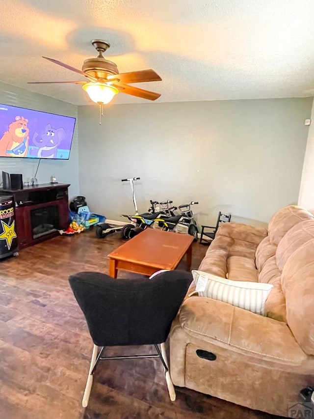 1320 Bradish Ave, La Junta, CO 81050 - living room with a ceiling fan and a textured ceiling