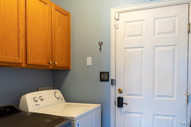 laundry room featuring cabinet space and washing machine and dryer