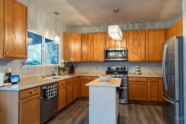 kitchen with a sink, light countertops, dark wood finished floors, and stainless steel appliances