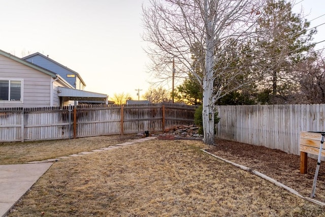 view of yard featuring a fenced backyard