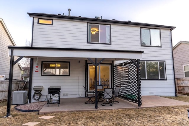 back of property featuring a patio, central AC unit, fence, and crawl space