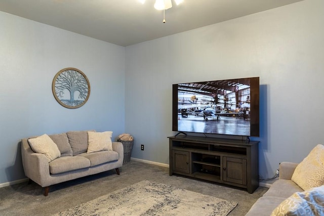 living room featuring baseboards and light carpet