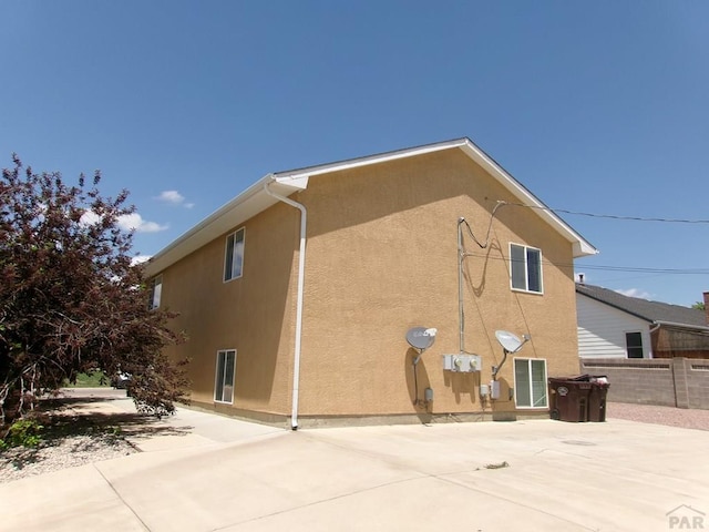 2110 Northmoor Ter Unit 2, Pueblo, CO 81001 - view of home's exterior featuring stucco siding and a patio