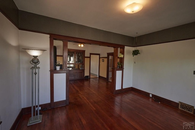315 S Oak St, Trinidad, CO 81082 - unfurnished living room featuring dark wood finished floors and baseboards