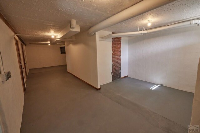 315 S Oak St, Trinidad, CO 81082 - finished below grade area with a textured ceiling and baseboards