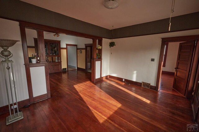 315 S Oak St, Trinidad, CO 81082 - unfurnished living room featuring dark wood-style flooring and baseboards