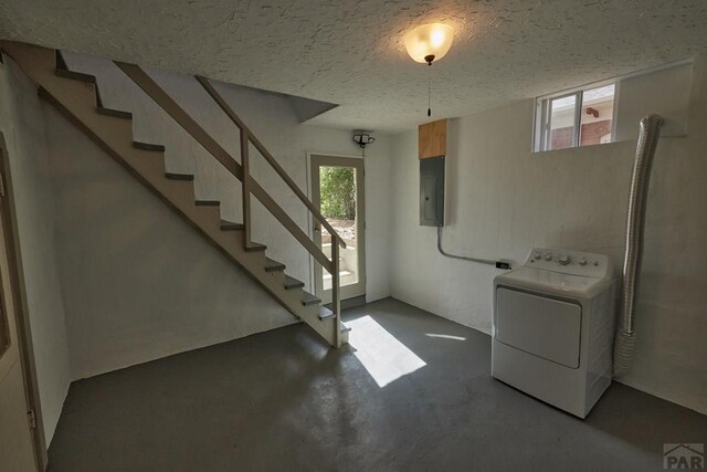 315 S Oak St, Trinidad, CO 81082 - basement featuring washer / dryer, electric panel, a textured ceiling, and stairs