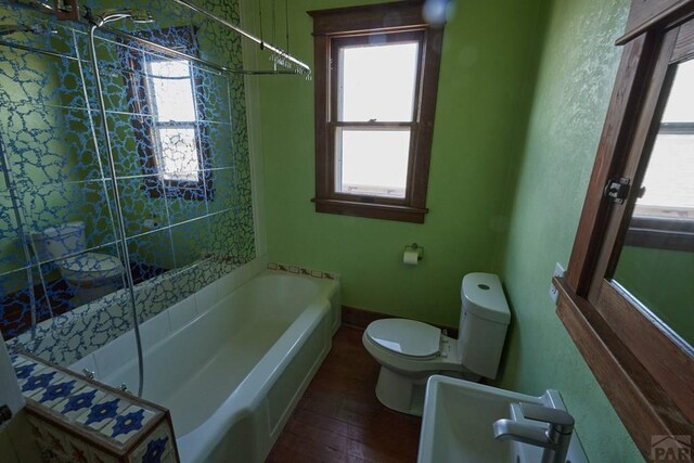 315 S Oak St, Trinidad, CO 81082 - full bathroom featuring plenty of natural light, a tub, and toilet