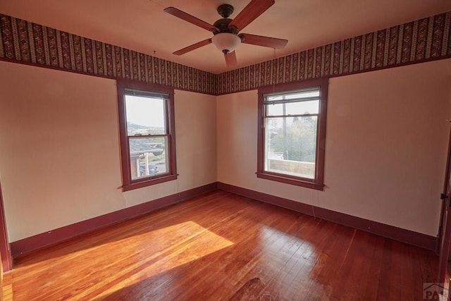 315 S Oak St, Trinidad, CO 81082 - empty room featuring baseboards, hardwood / wood-style floors, healthy amount of natural light, and ceiling fan