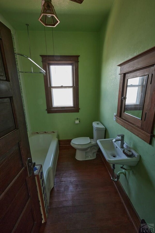 315 S Oak St, Trinidad, CO 81082 - full bath with toilet, a bath, hardwood / wood-style floors, a sink, and a shower