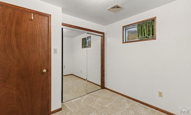 4321 Goodnight Ave, Pueblo, CO 81005 - interior space featuring light colored carpet, baseboards, and visible vents