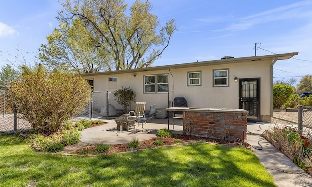 4321 Goodnight Ave, Pueblo, CO 81005 - back of house with fence, a fire pit, a yard, and a patio