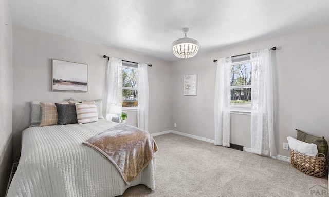 4321 Goodnight Ave, Pueblo, CO 81005 - bedroom featuring carpet, baseboards, and a notable chandelier