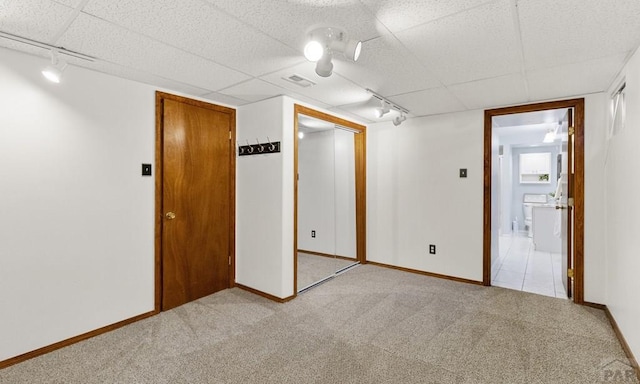 4321 Goodnight Ave, Pueblo, CO 81005 - unfurnished room with track lighting, light carpet, a paneled ceiling, and baseboards