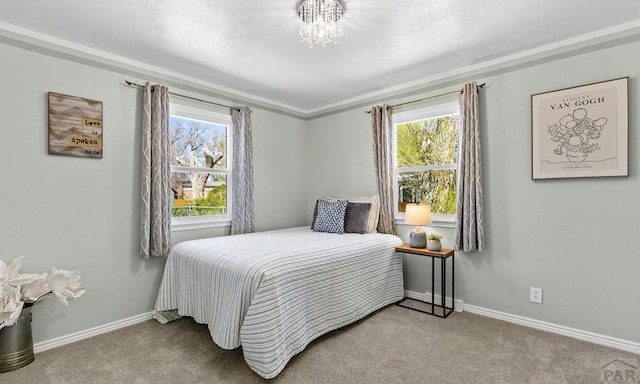 4321 Goodnight Ave, Pueblo, CO 81005 - bedroom featuring a notable chandelier, carpet flooring, and multiple windows