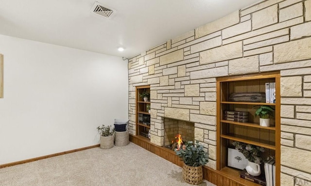 4321 Goodnight Ave, Pueblo, CO 81005 - carpeted living area featuring baseboards, visible vents, and a fireplace
