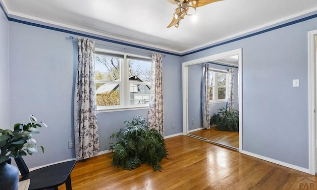 4321 Goodnight Ave, Pueblo, CO 81005 - interior space featuring ceiling fan, baseboards, crown molding, and wood finished floors