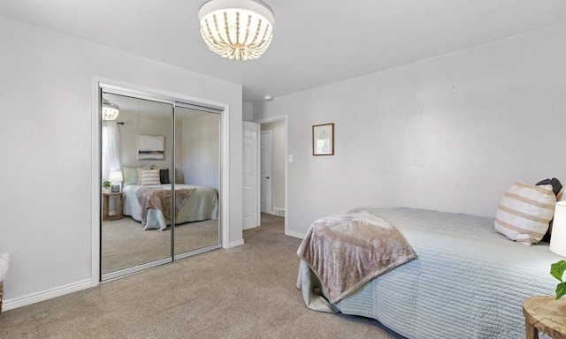 4321 Goodnight Ave, Pueblo, CO 81005 - bedroom with baseboards, a notable chandelier, carpet flooring, and a closet