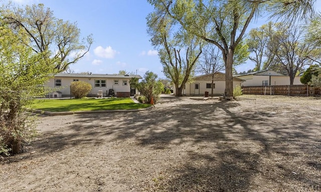 4321 Goodnight Ave, Pueblo, CO 81005 - back of property featuring a lawn and fence