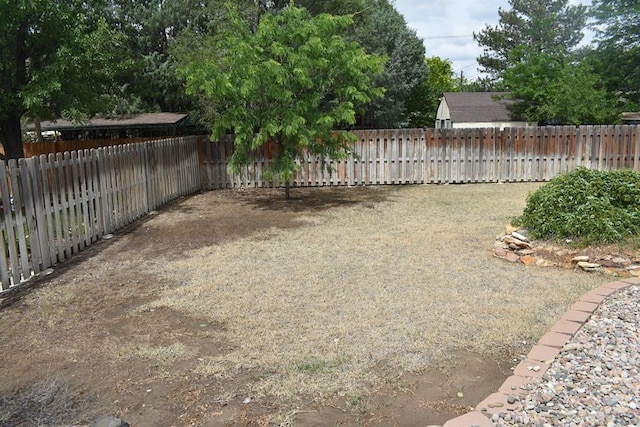 view of yard with a fenced backyard