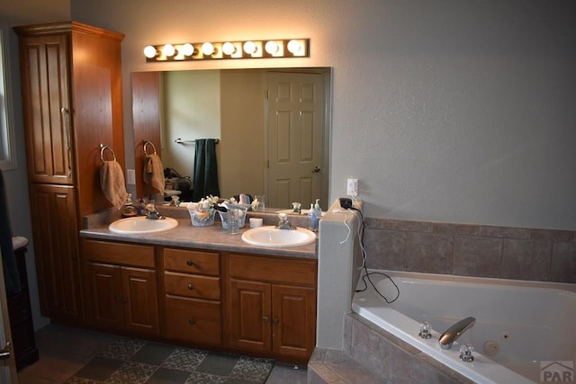 full bathroom featuring double vanity, a tub with jets, and a sink