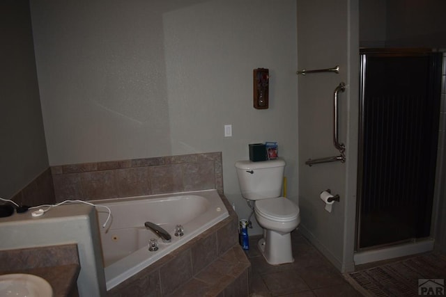 full bathroom with tile patterned floors, a garden tub, toilet, and a shower stall
