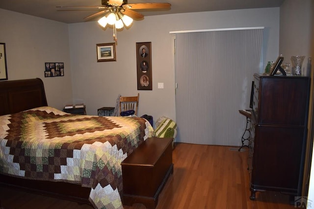 bedroom with ceiling fan and wood finished floors