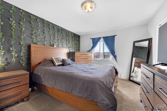 bedroom with light carpet and baseboards