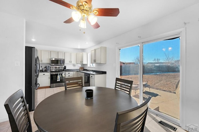 dining space with light tile patterned floors, ceiling fan, visible vents, and recessed lighting