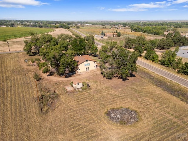 birds eye view of property with a rural view