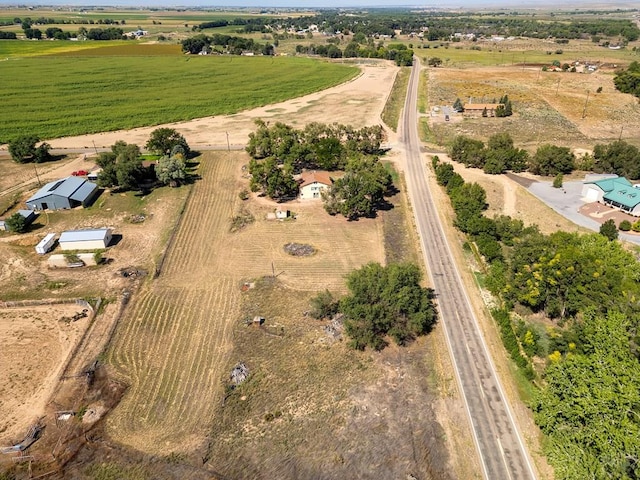 birds eye view of property with a rural view