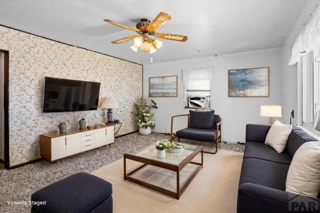 living area featuring ceiling fan