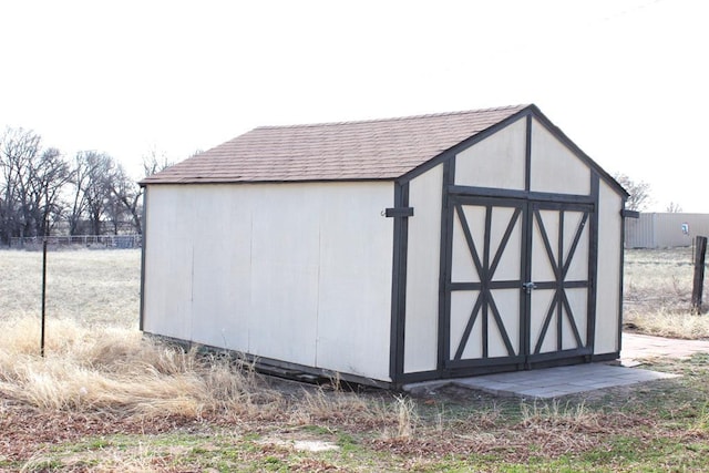 view of shed with fence