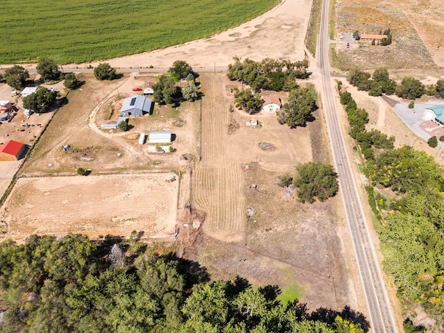 birds eye view of property with a rural view