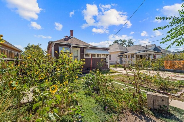 view of front of house with fence