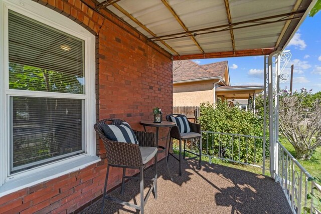 view of patio / terrace with a balcony