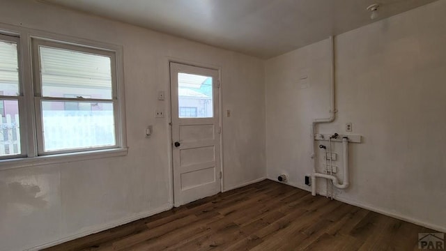 doorway to outside featuring dark wood finished floors