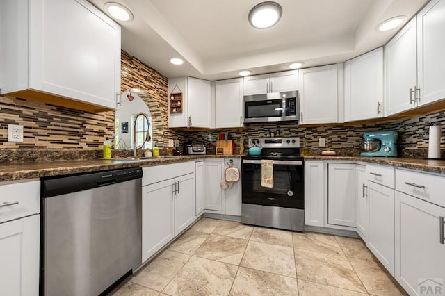 40 Macalester Rd, Pueblo, CO 81001 - kitchen featuring appliances with stainless steel finishes, a sink, backsplash, white cabinets, and recessed lighting