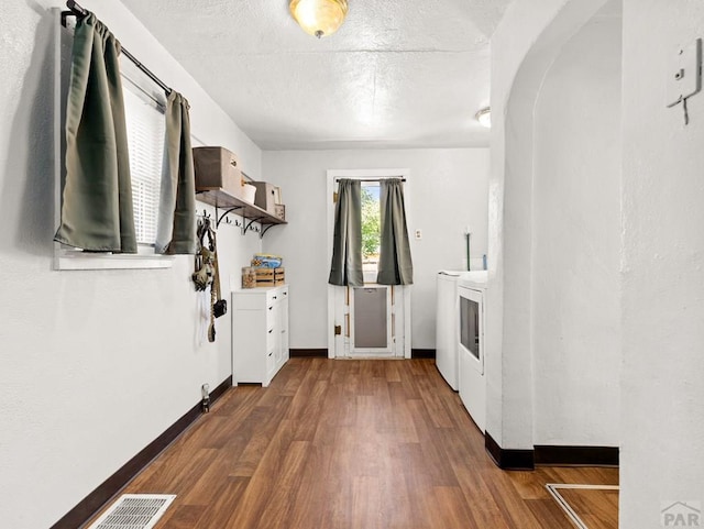 309 Quincy St, Pueblo, CO 81004 - washroom featuring independent washer and dryer, wood finished floors, baseboards, and a textured ceiling