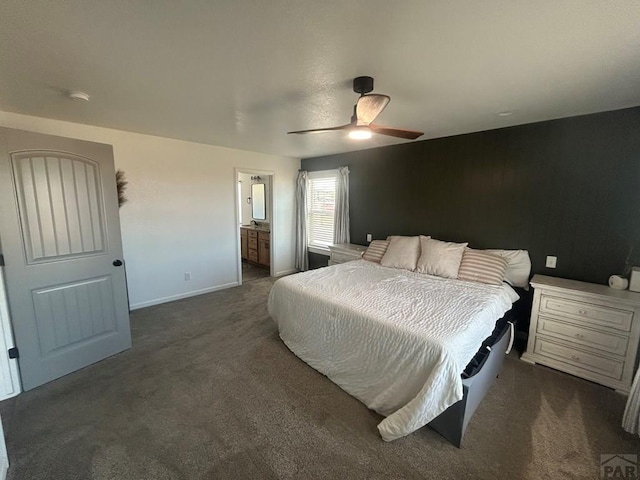 bedroom featuring carpet flooring, a ceiling fan, baseboards, and connected bathroom